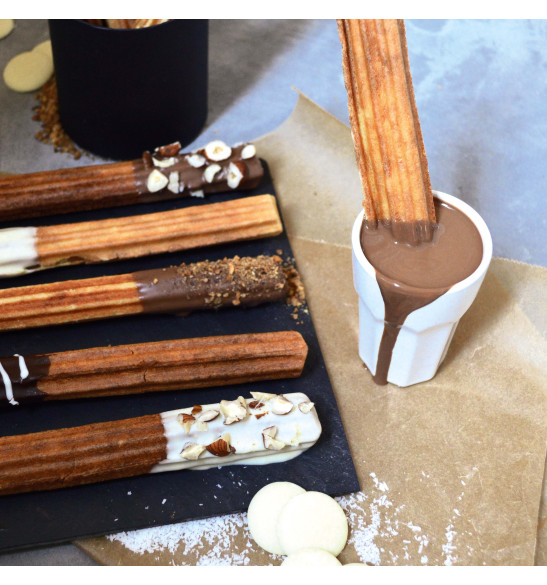 Churros dipped in melted chocolate